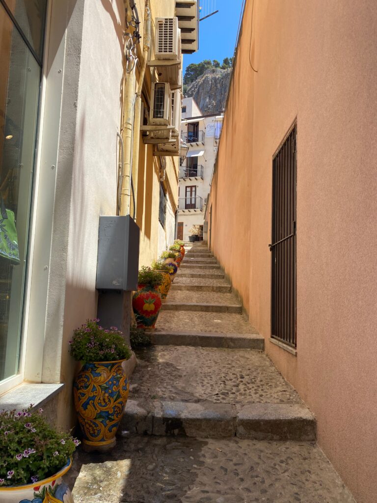 Narrow cobblestone alley in Cefalu' Sicily