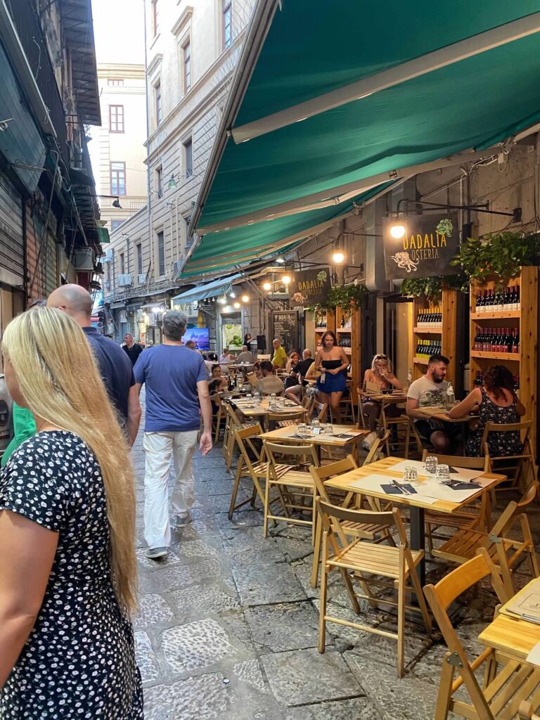 Row of tables set for dinner in Palermo