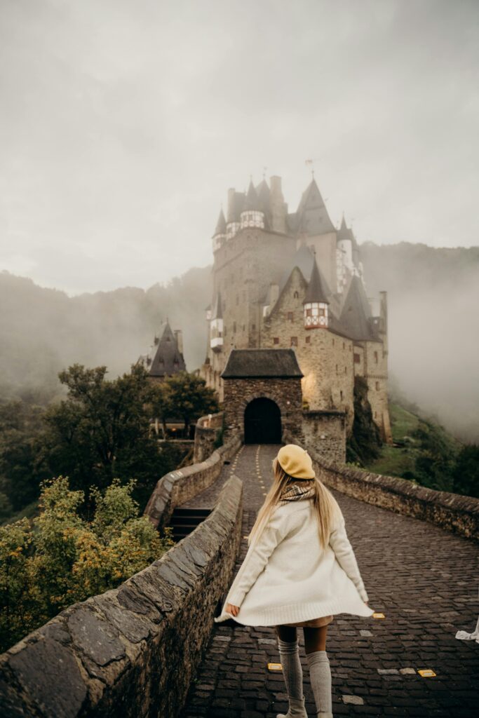 Traveler enjoying a scenic European street during shoulder season, capturing quiet charm and ideal conditions for luxury travel