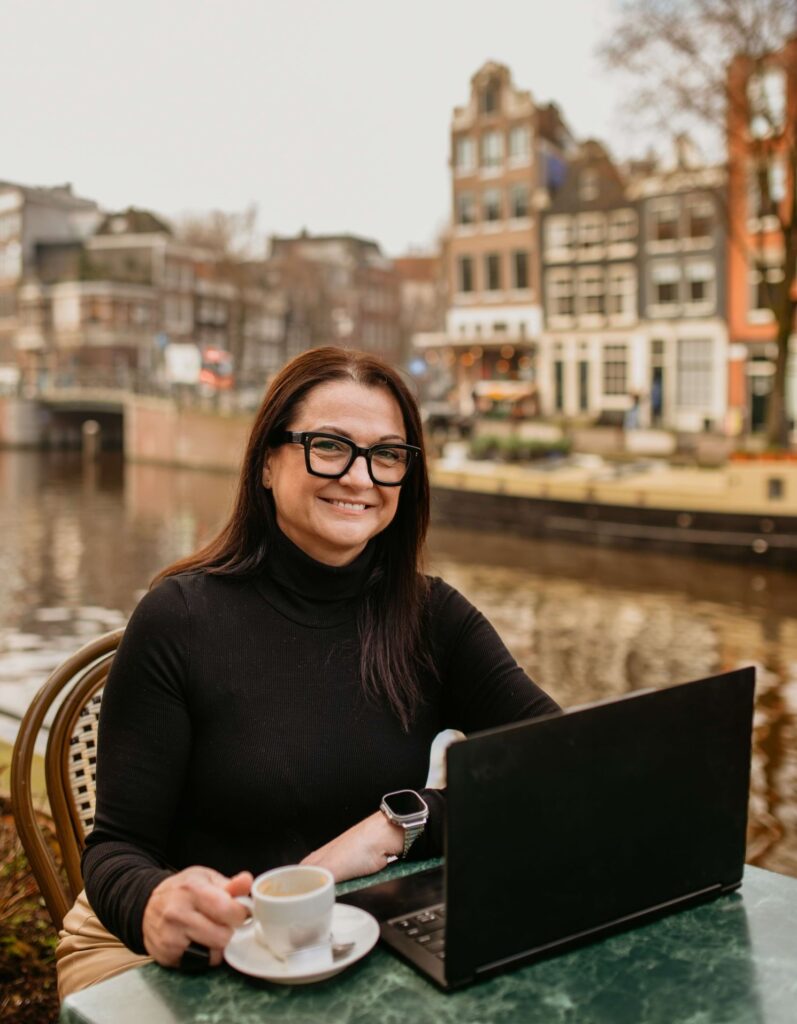 Travel agent Rachel Stankovic creating personalized itineraries for clients while working in Amsterdam.